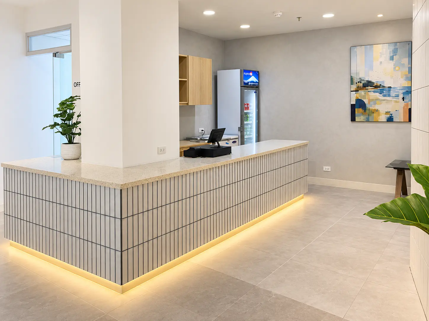 The TSA cafe counter with its drinks fridge and till